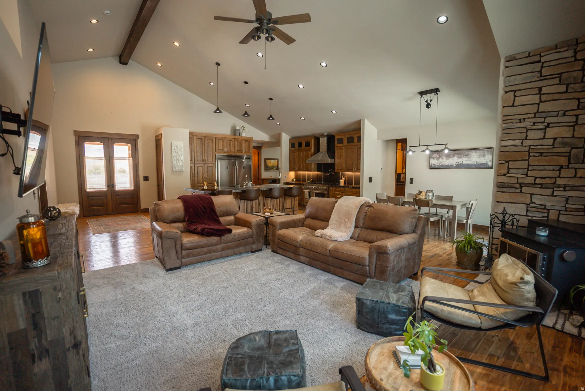Spacious great room with vaulted ceilings and exposed wood beams