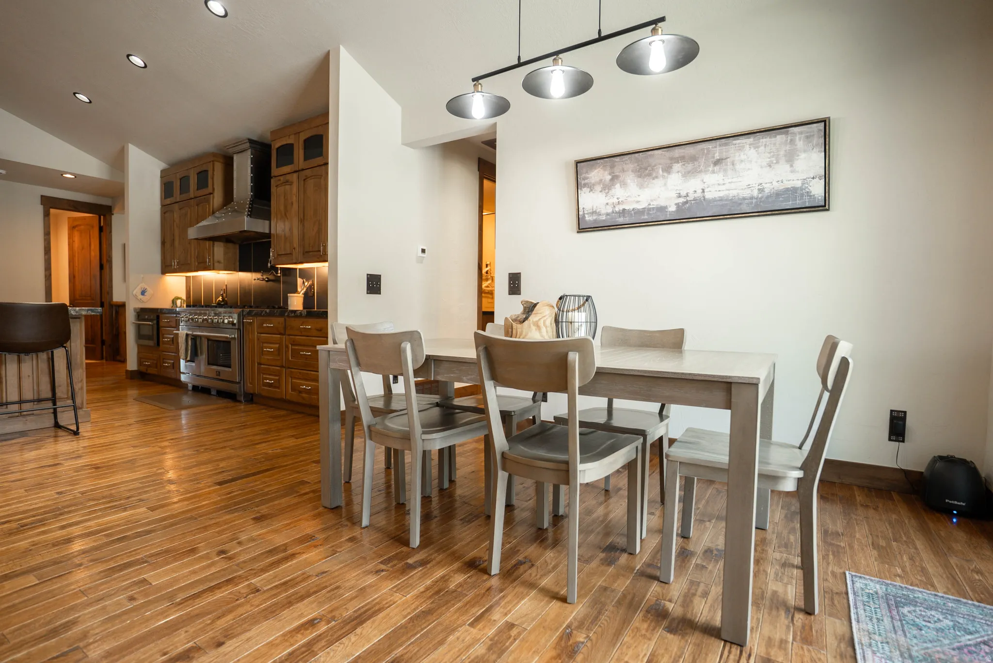 Open-concept living space featuring wood-finish flooring throughout