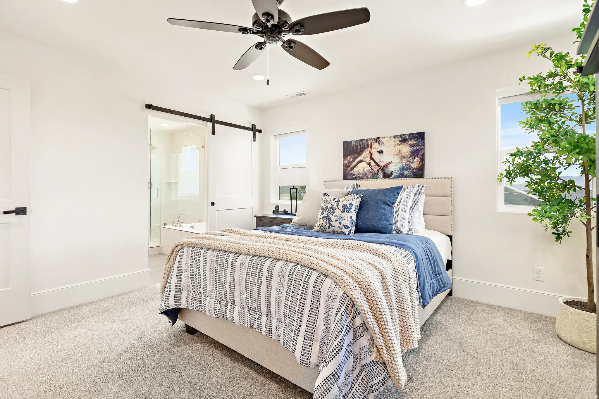 Spacious bedroom featuring recessed lighting, a ceiling fan, and carpeted flooring