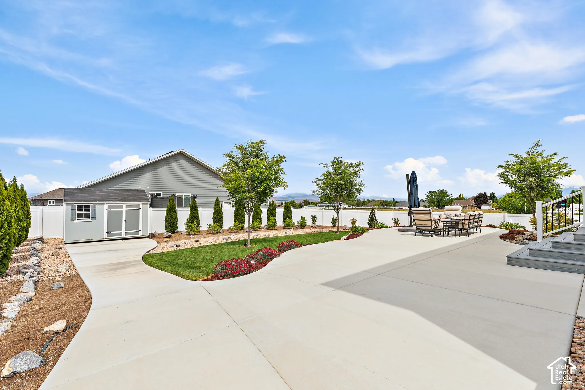 Expansive concrete patio with multiple levels and integrated steps