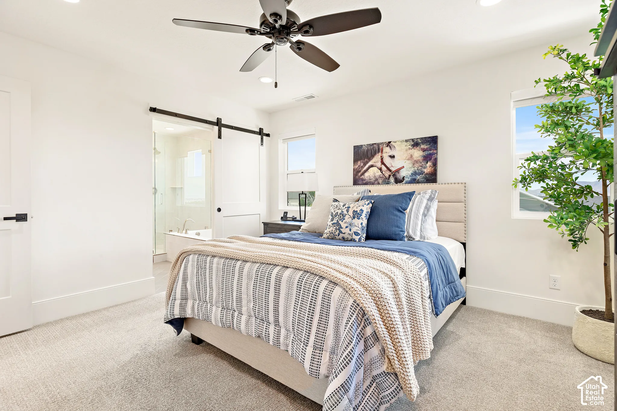 Spacious bedroom featuring recessed lighting, a ceiling fan, and carpeted flooring