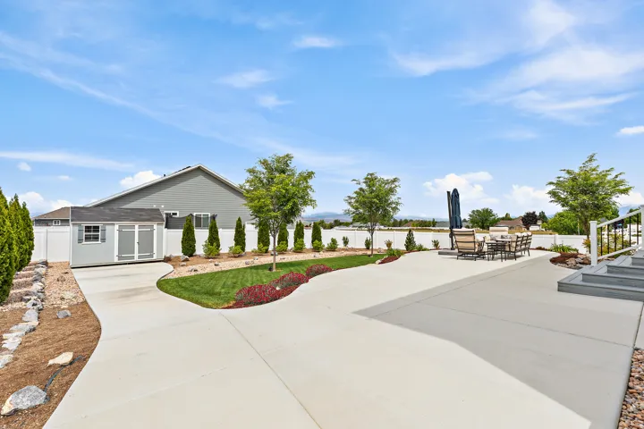 Expansive concrete patio with multiple levels and integrated steps