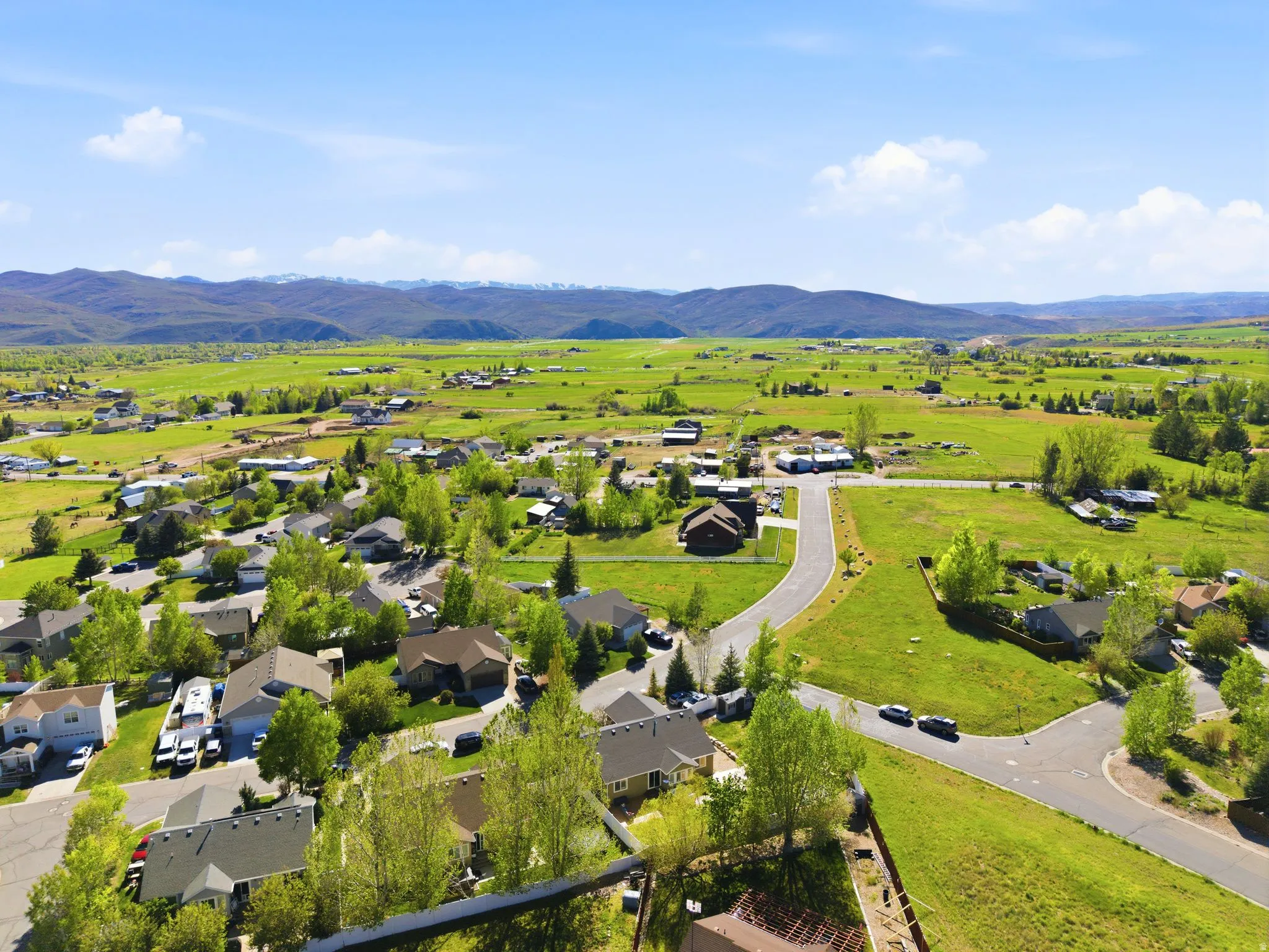 Expansive residential area featuring a mix of established homes and undeveloped green spaces