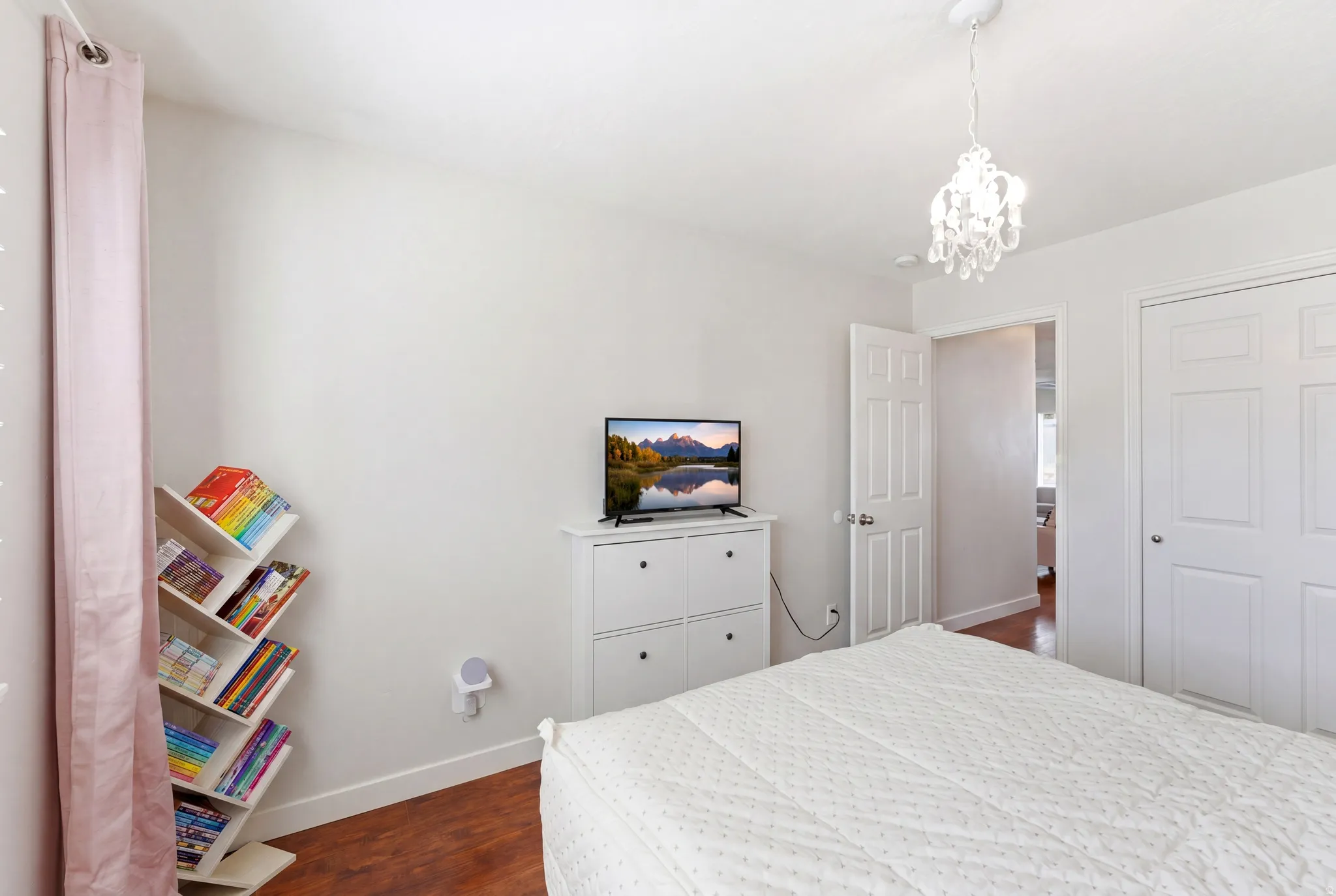White interior walls with wood-finish flooring