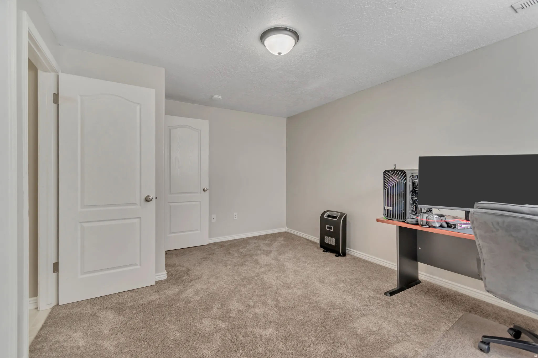 Neutral wall color, wall-to-wall carpeting, and white trim