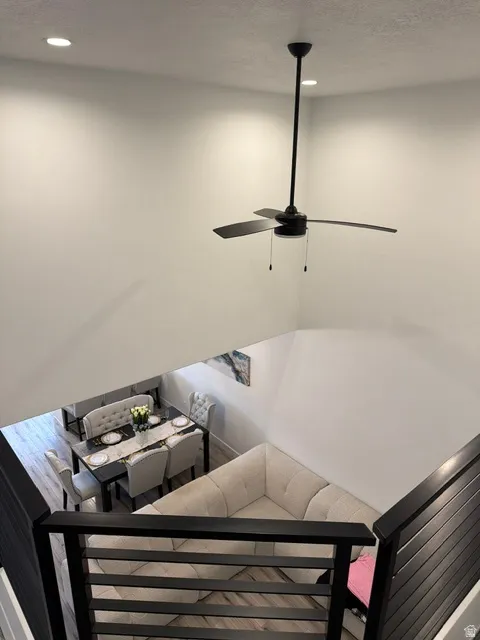 Open-concept living space with high ceilings and recessed lighting