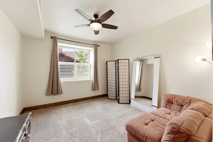 Neutral wall finishes complement the textured carpeting