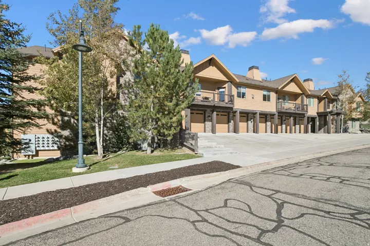 Townhome-style residences featuring individual garage access and upper-level balconies