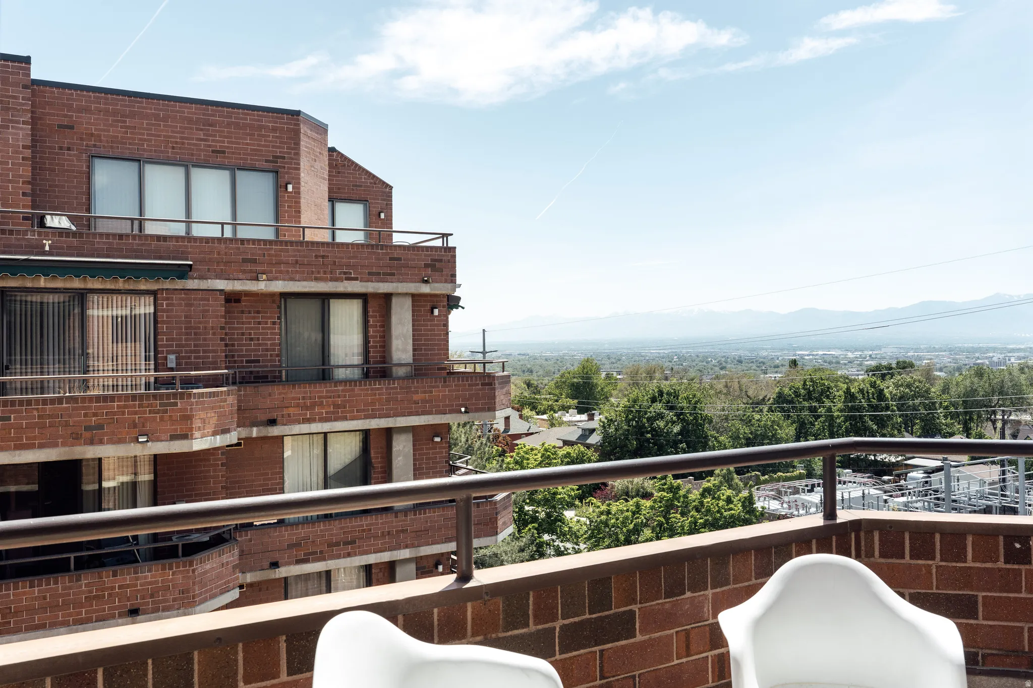 Terrace with metal railing and brick balustrade