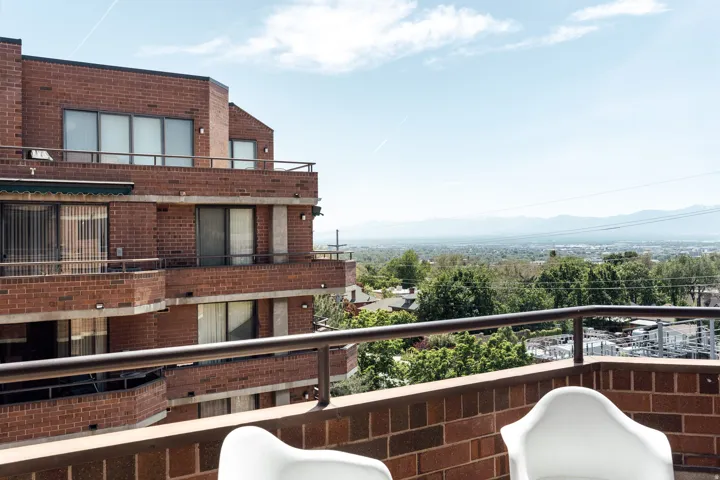 Terrace with metal railing and brick balustrade