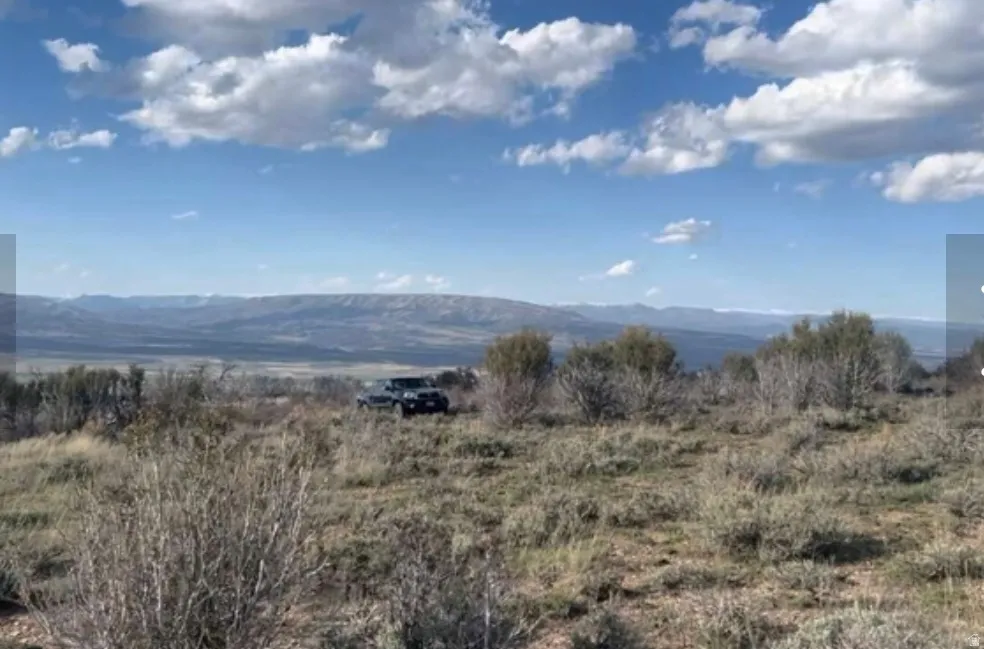 Expansive natural landscape with distant mountain ranges