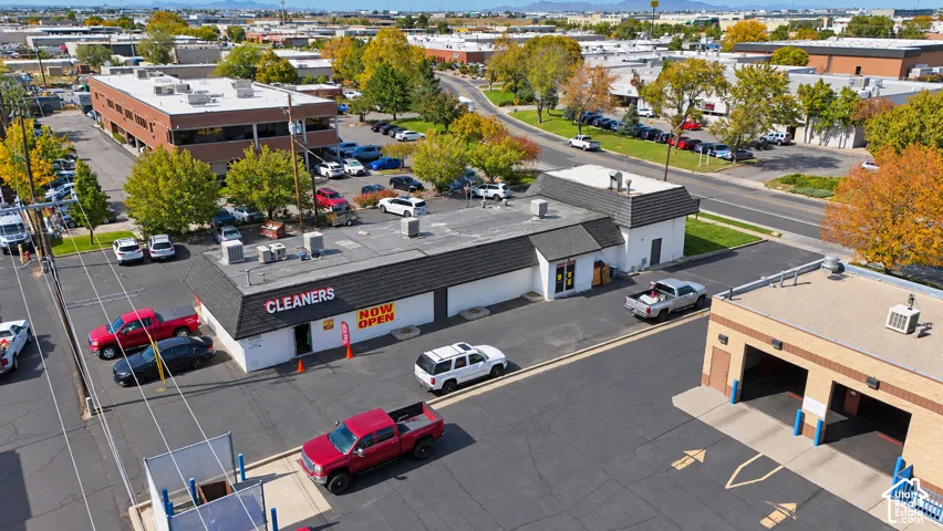 Commercial property featuring multiple buildings with paved parking areas