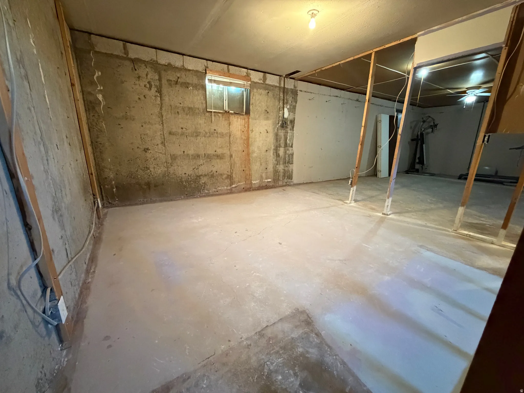 Concrete flooring with a partial concrete block wall
