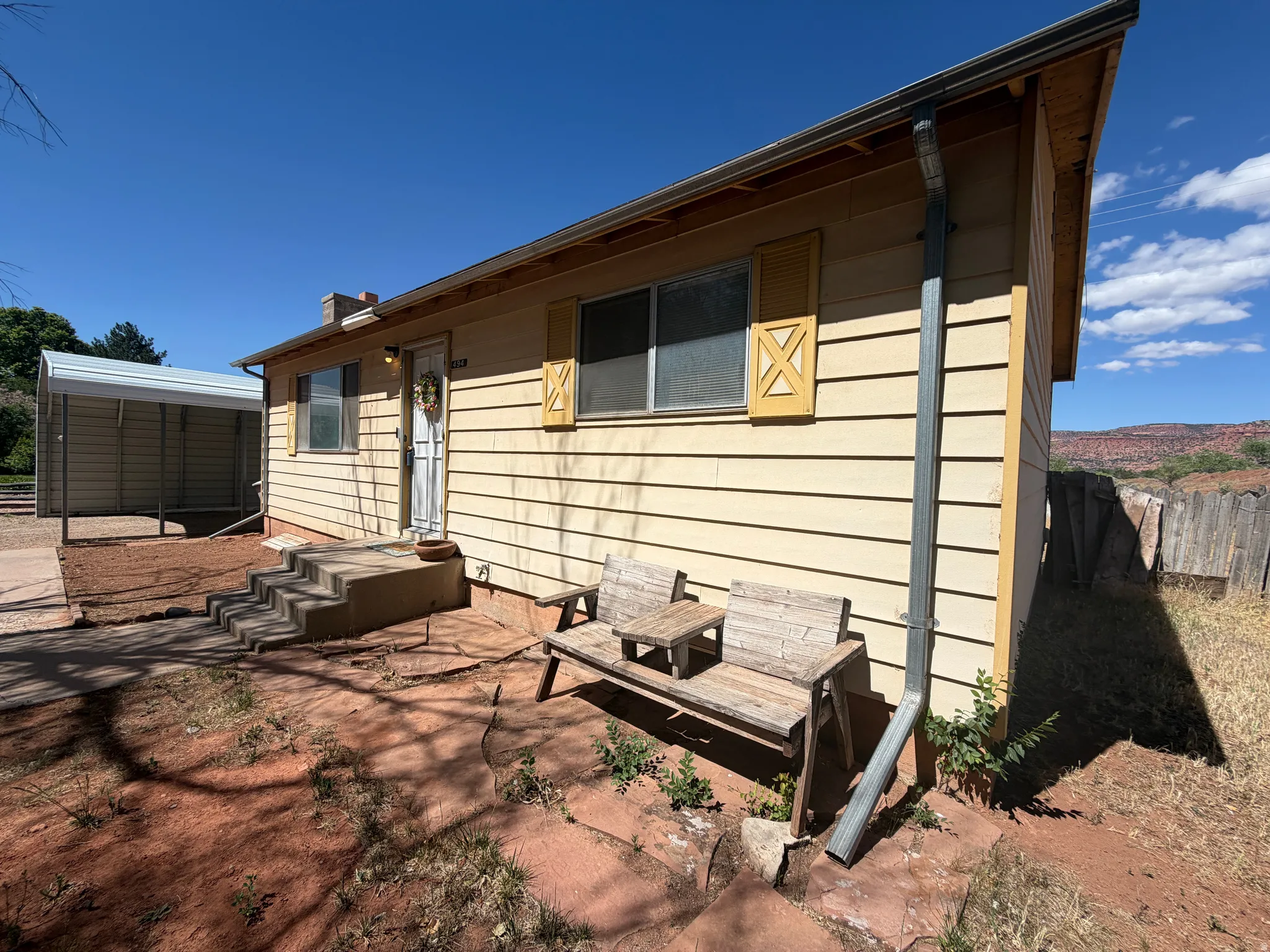 Exterior with horizontal siding and decorative window shutters