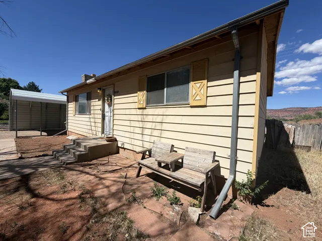 Exterior with horizontal siding and decorative window shutters
