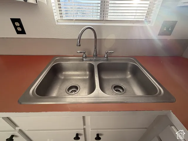 Double basin stainless steel sink with a chrome faucet