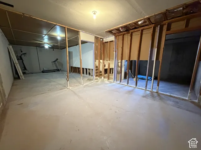 Unfinished basement space with exposed framing and concrete flooring, offering versatile customization potential