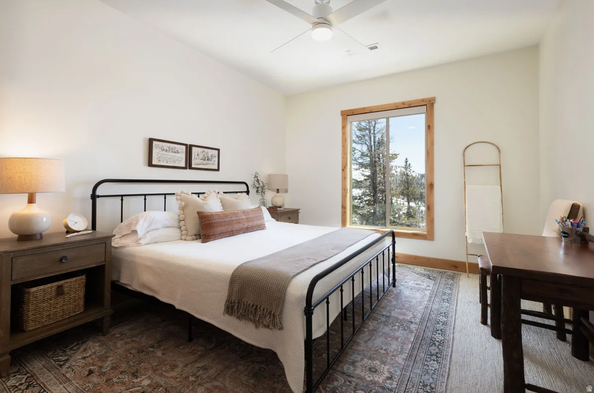Bright interior with a large window featuring natural wood trim