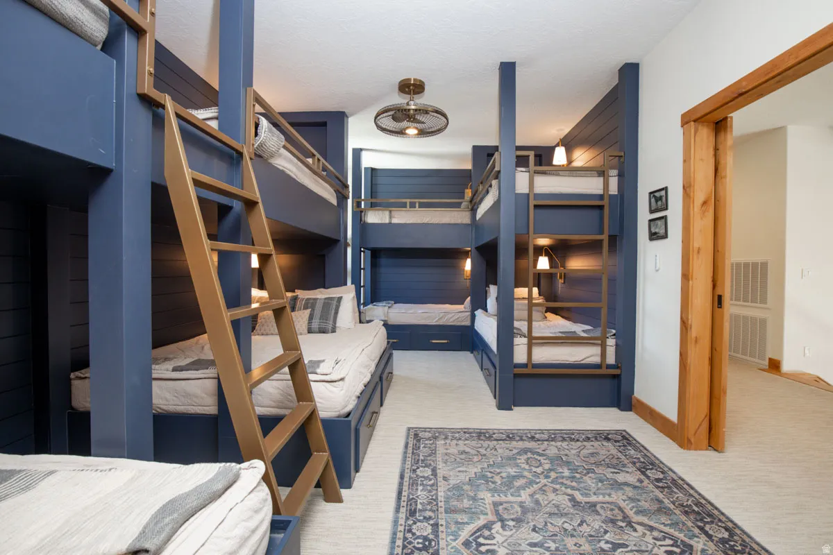 Custom-built bunk beds with integrated lighting and storage drawers