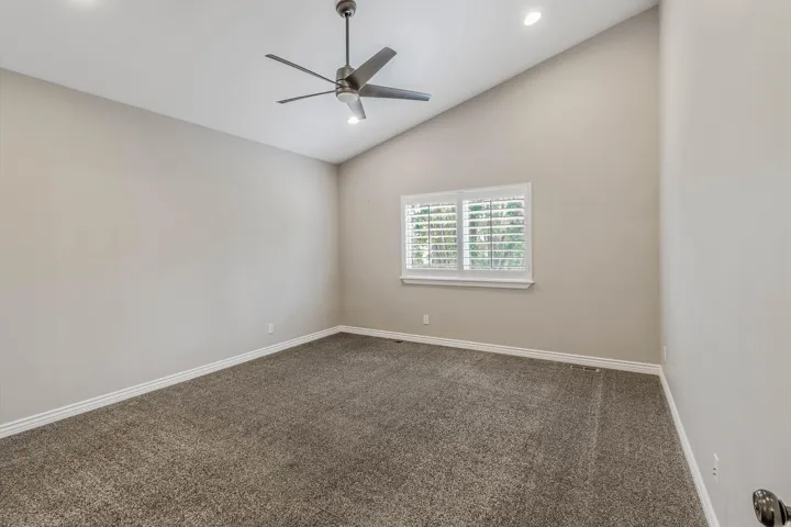 Vaulted ceilings with recessed lighting and a modern ceiling fan