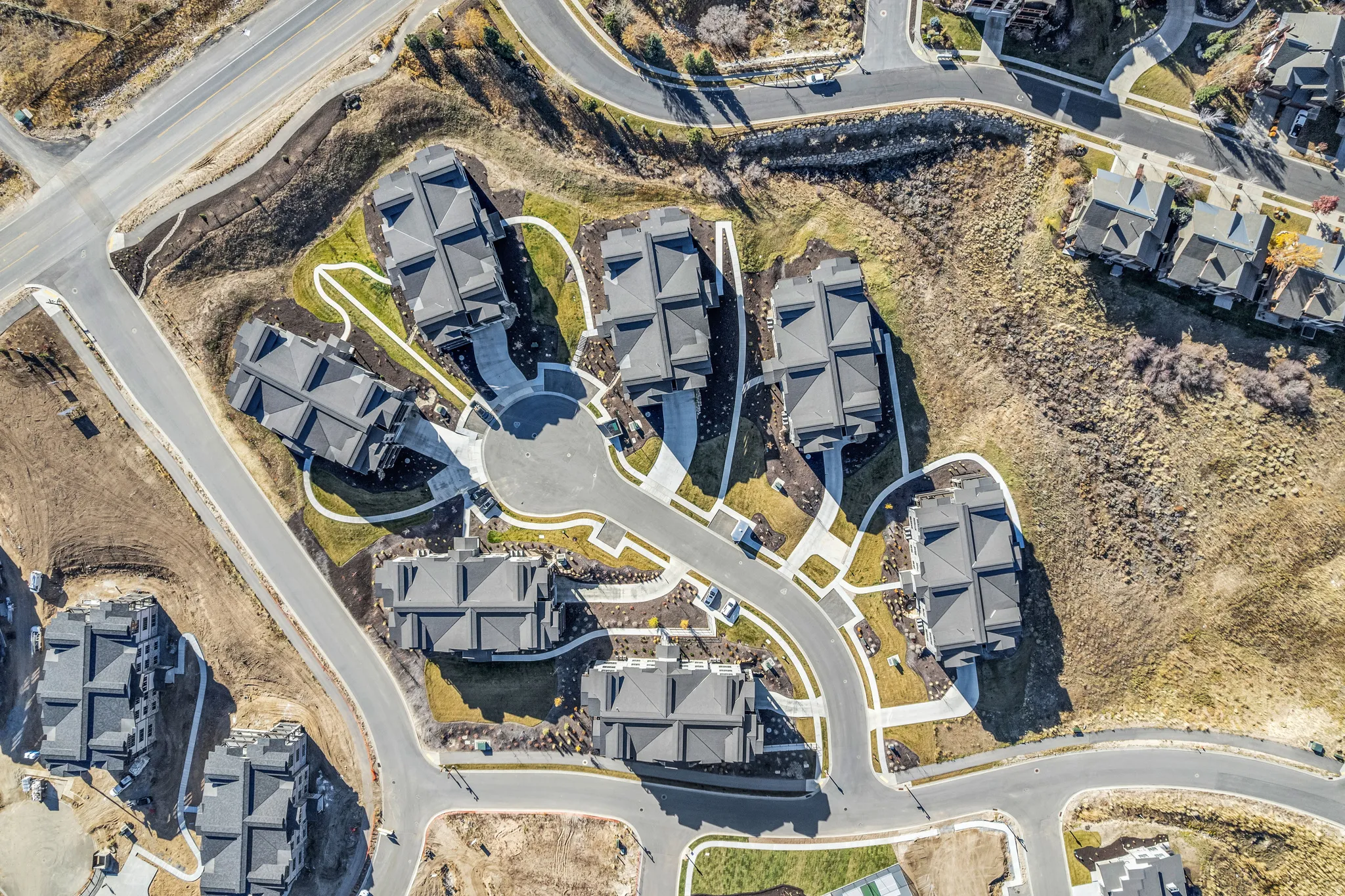 Aerial perspective of a developed residential cluster featuring a cul-de-sac and multiple properties