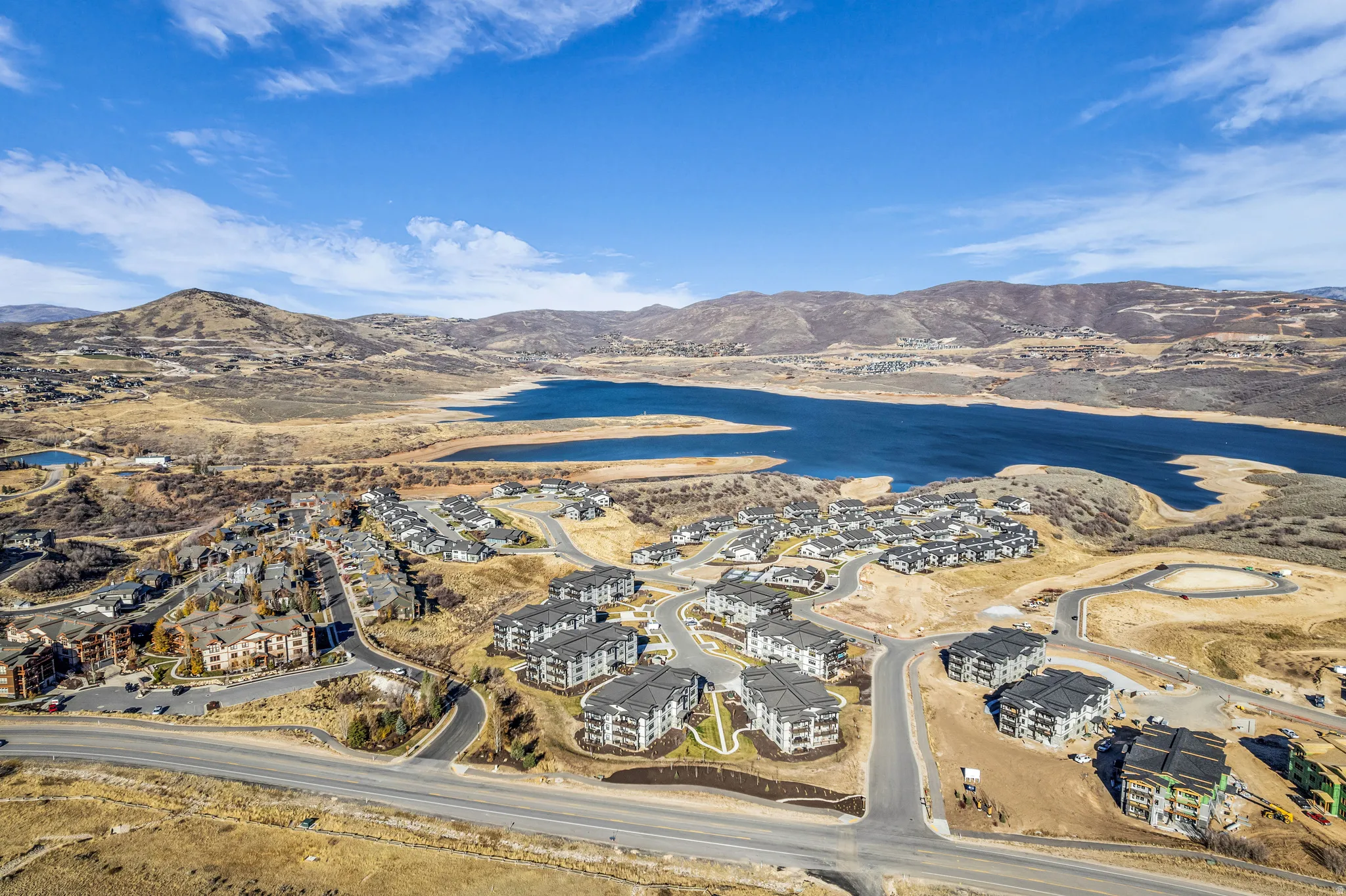 Expansive aerial showcasing a developing community with varied housing styles