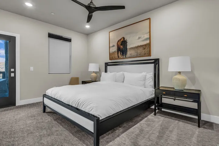 Carpeted room featuring a ceiling fan with recessed lighting, an exterior door with glass panels, and a window with blinds