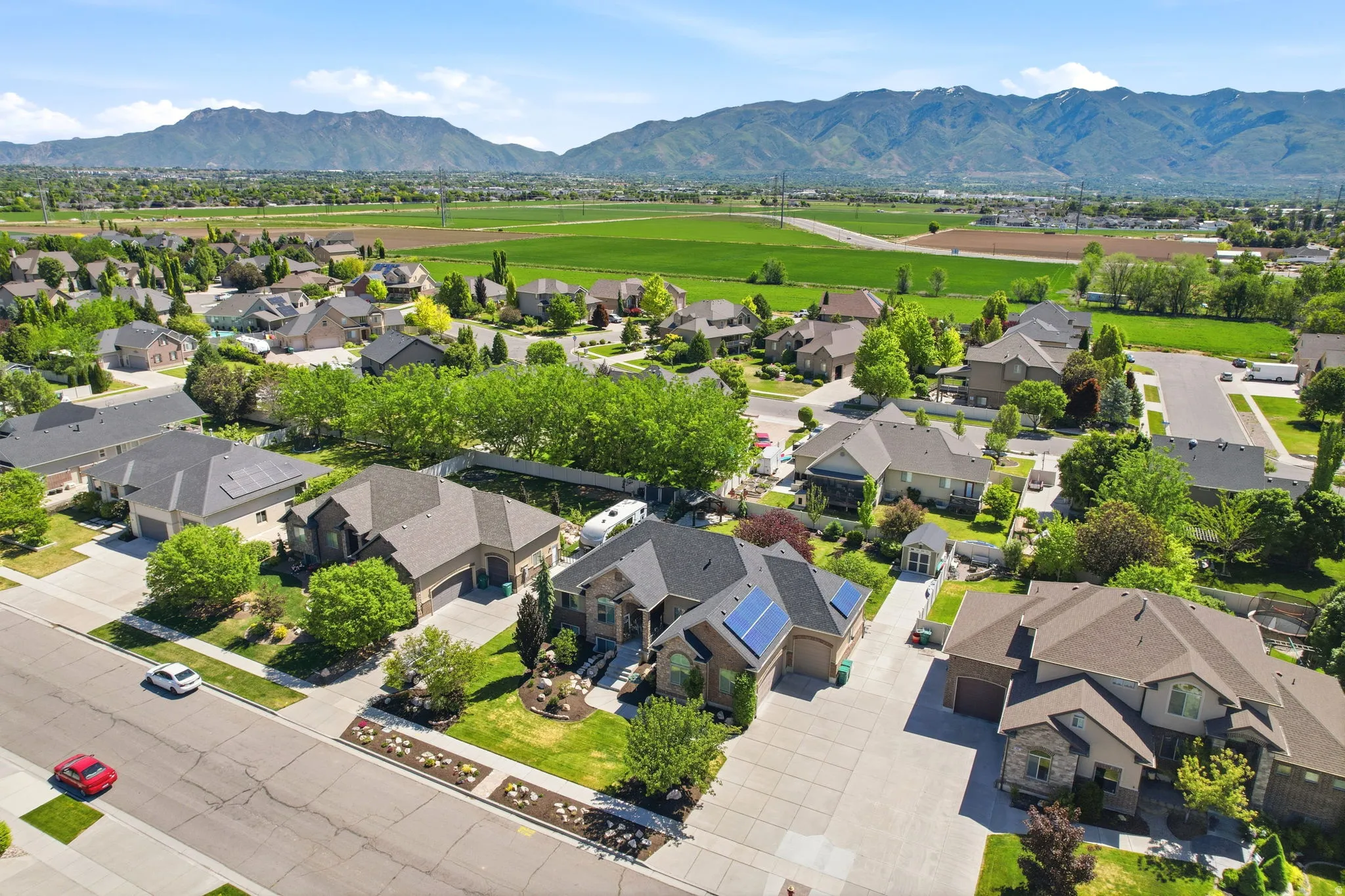 Aerial view of a residential neighborhood with mountain backdrop