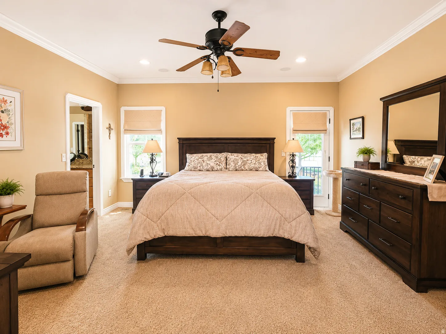 Carpeted room with a ceiling fan, recessed lighting, crown molding, and two windows with Roman shades