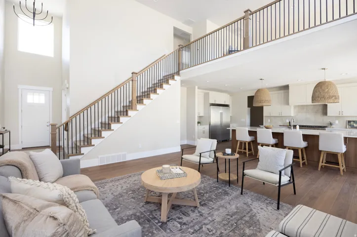 Two-story foyer with a modern chandelier and high ceilings