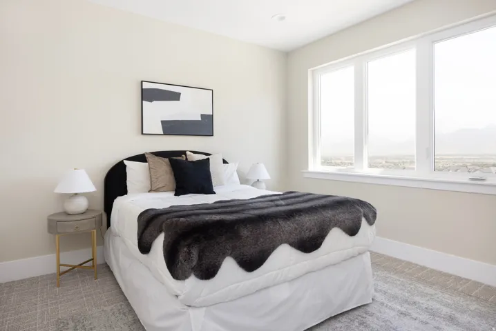 Bedroom featuring expansive windows, recessed lighting, neutral wall tones, and patterned carpeting