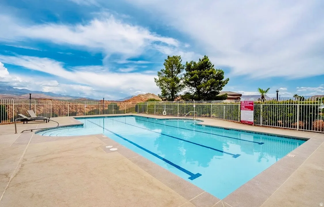 Expansive swimming pool featuring lap lanes and integrated steps