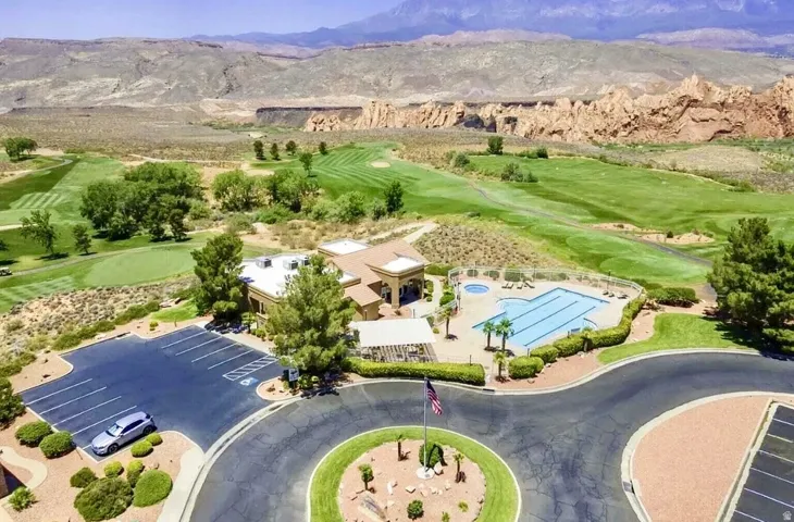 Expansive community amenities including a swimming pool, spa, and golf course access