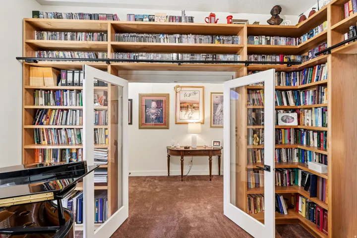 Built-in wood shelving encompassing a doorway, providing extensive storage