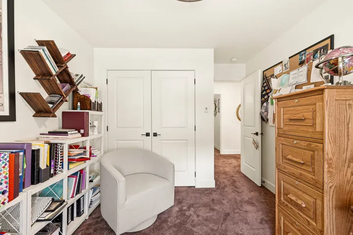 White walls with a textured purple carpet