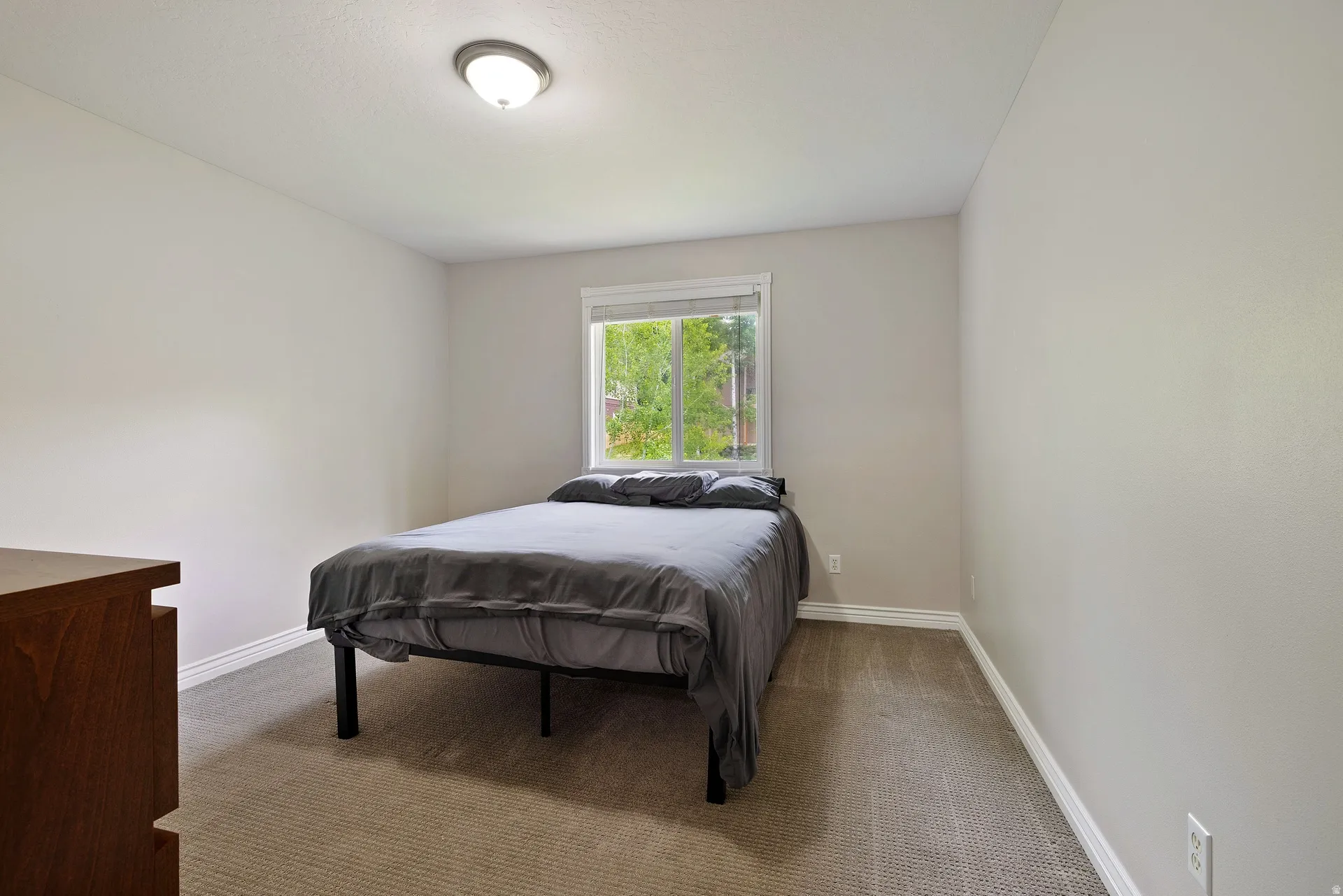 Neutral wall paint complemented by white baseboards