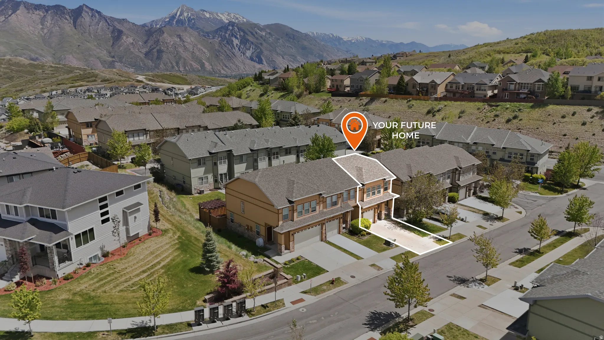 Townhome property featuring a two-car garage, pitched roof, and modern exterior finishes