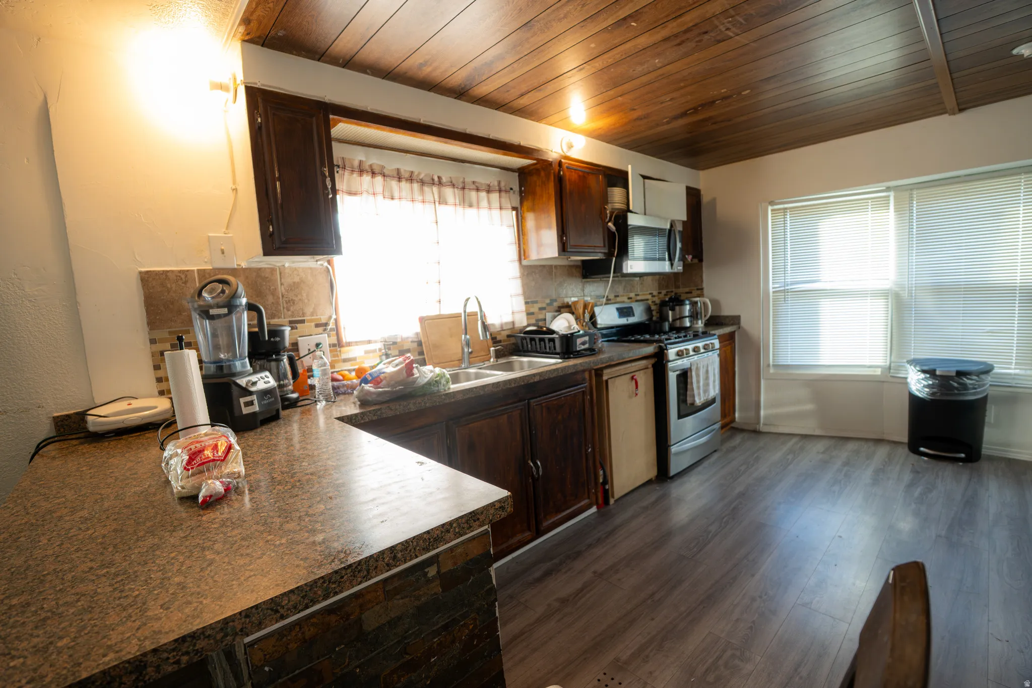 Kitchen featuring wood-finish flooring and a wood plank ceiling