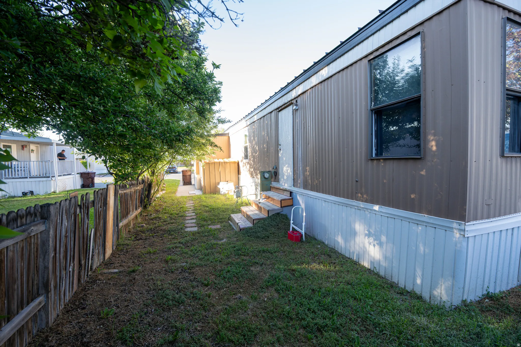 Exterior siding with multiple windows and a side entry