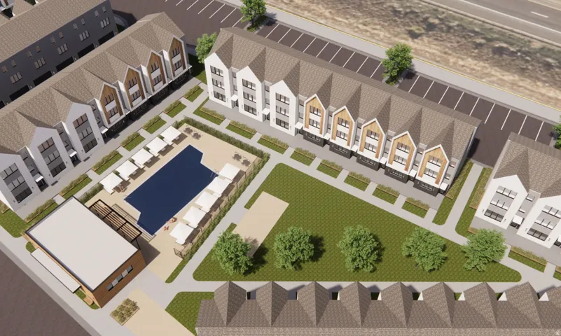 Community pool area featuring a rectangular pool, surrounding lounge seating, and a dedicated pool house