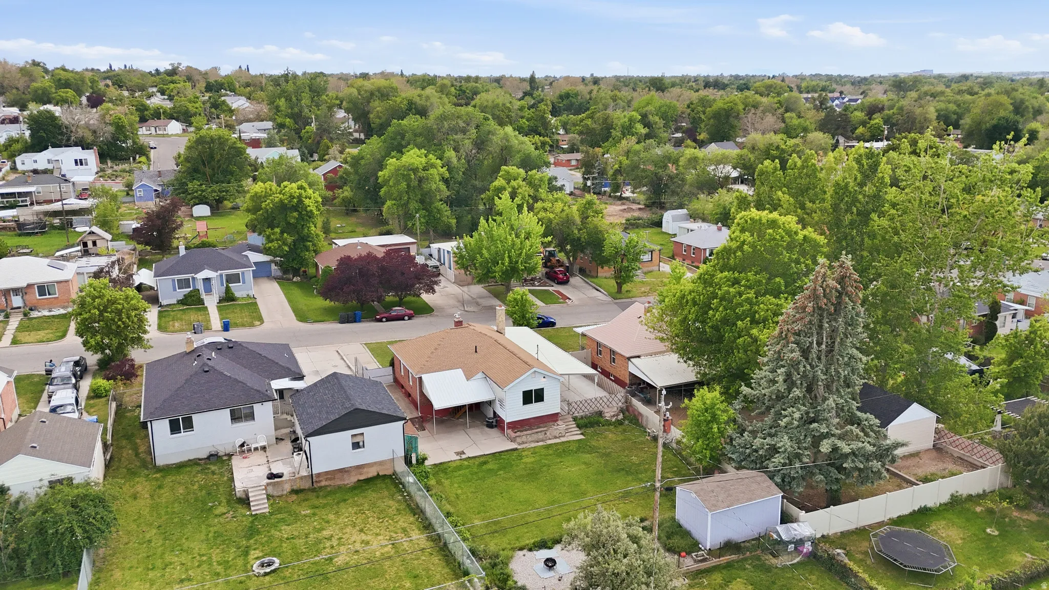 Residential neighborhood featuring mature trees and established properties