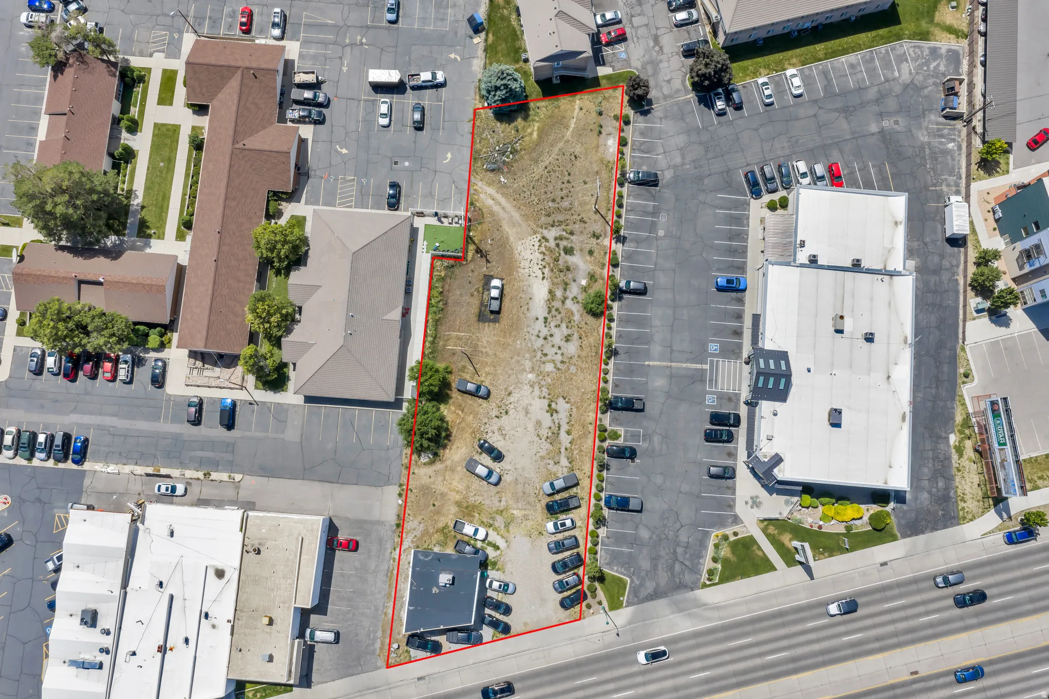 Expansive undeveloped parcel outlined in red, featuring a rectangular shape and a flat topography