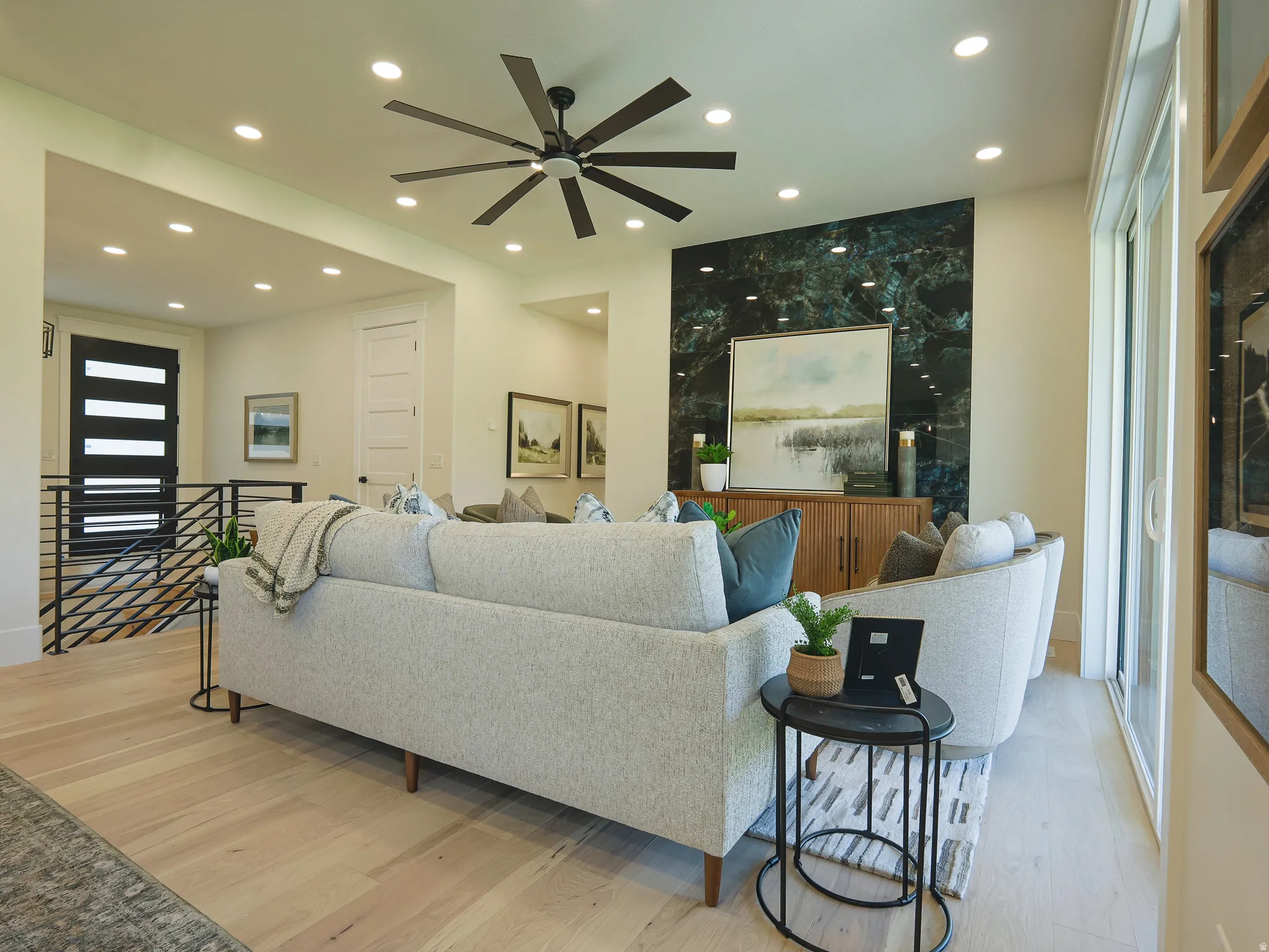 Hardwood flooring extending throughout the open-concept living area