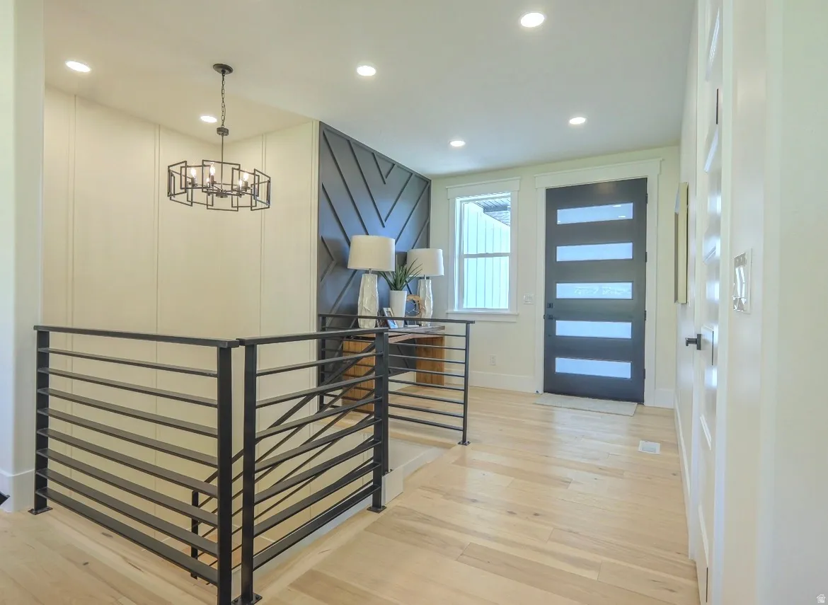 Entryway featuring light wood-finish flooring and recessed ceiling lighting