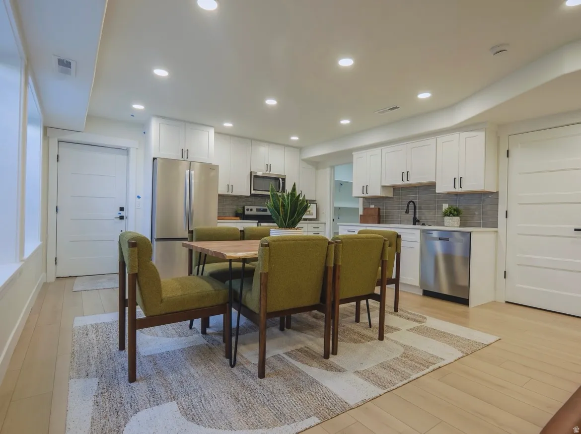 Open-concept living space featuring light wood-finish flooring