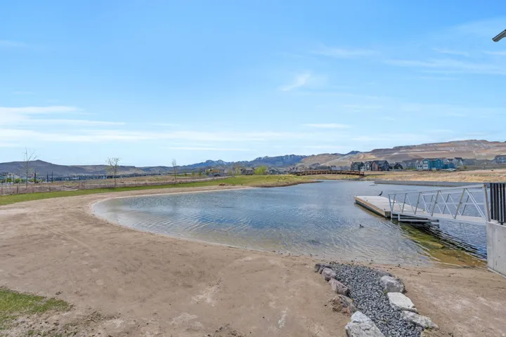 Dock area with a water and mountain view
