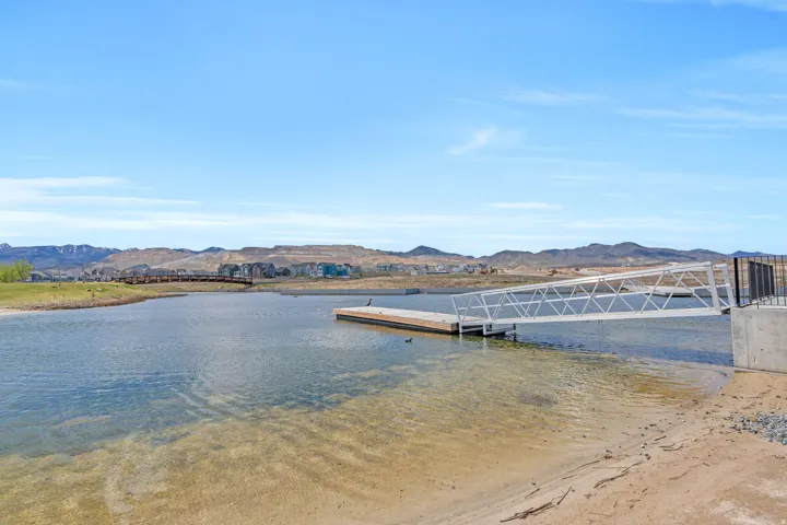 Dock featuring a water and mountain view