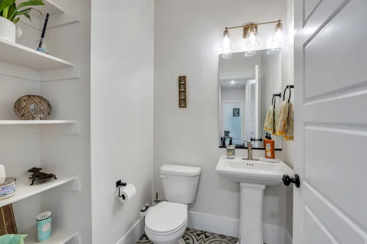 Bathroom featuring toilet and baseboards
