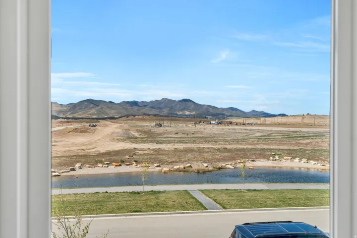 Mountain view featuring a large body of water and rural landscape