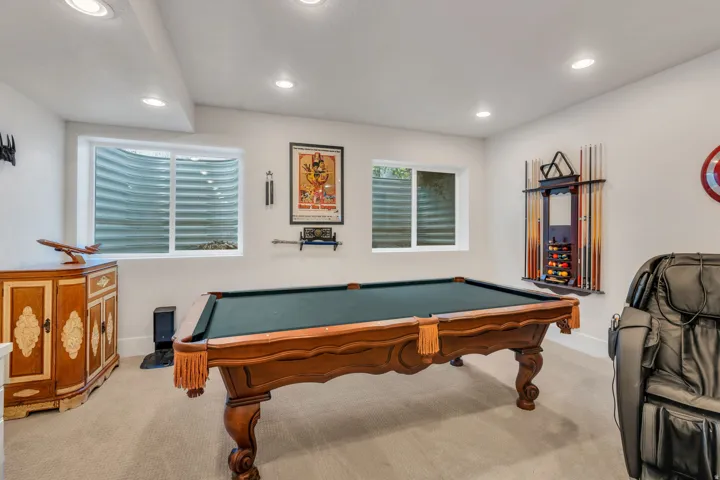 Recreation room with light colored carpet, recessed lighting, and pool table